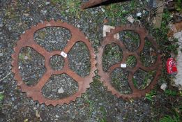 Two cast iron sprockets, 20'' wide.