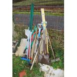 A bow saw, shovel, spirit level, brushes, hoe etc.