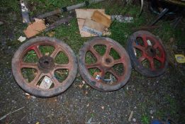 Three cast iron centre rubber banded wheels, 20'' diameter.