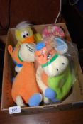 A box of cuddly toys and a small child's clock.