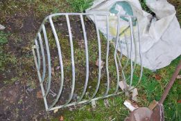 A galvanised wall mounted hay rack.