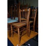 Two bedroom chairs with cane seats.