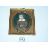 A Portrait Miniature of a boy with hobby horse, 3 3/4'' x 4 1/4'' including frame,
