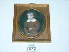 A Portrait Miniature of a boy with hobby horse, 3 3/4'' x 4 1/4'' including frame,