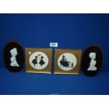 A pair of black silhouettes on card of young ladies signed G.A.