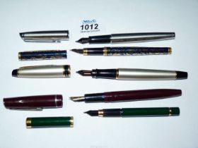 A quantity of Osmiroid and Waterman fountain and cartridge pens.