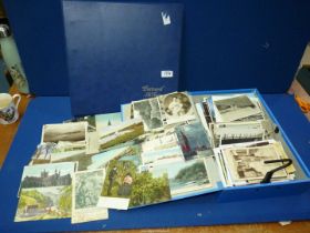 A box file of Postcards and a postcard album, mostly tourist, various ages.