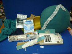 A Honiton lace Pillow and bobbins plus instruction booklets, impedimenta, etc.