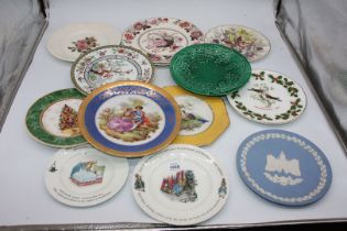 A quantity of wall plates to include; Mason's Brocade, Limoges, Wedgwood Peter Rabbit, etc.