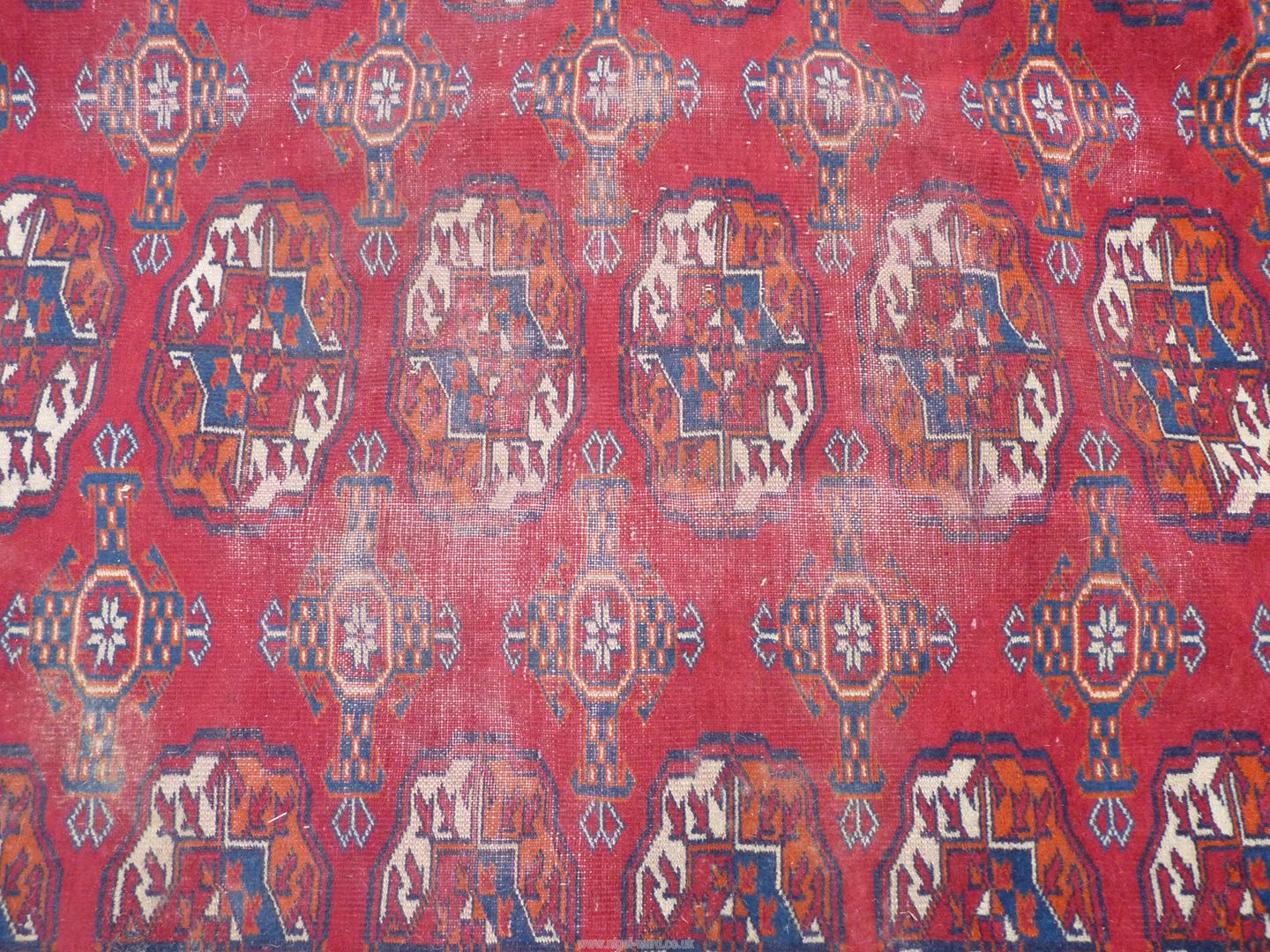 A large carpet in red and blue geometric design. 173" x 121". - Image 2 of 6