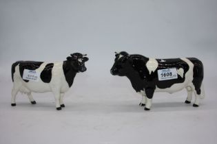 A Beswick 'Ch Coddington' Friesian bull ( chip to front leg) and a Beswick 'Claybury Legwater'