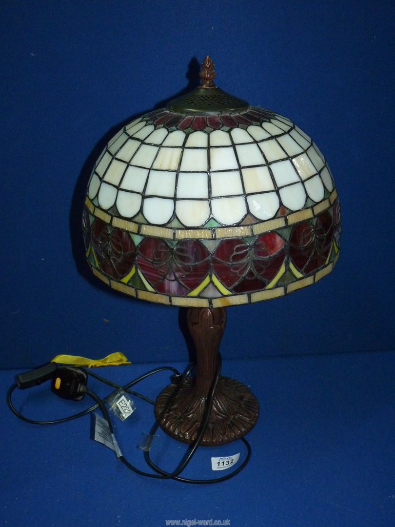 A Tiffany style lamp and glass shade with red hearts, 21" tall.