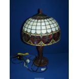 A Tiffany style lamp and glass shade with red hearts, 21" tall.