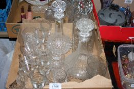 Three decanters, one square with lattice decoration, plus sherry glasses and whisky glasses, etc.