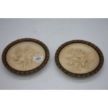 A pair of Victorian plaster plaques, 6 3/4" diameter.