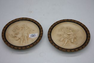 A pair of Victorian plaster plaques, 6 3/4" diameter.
