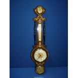 A banjo Barometer/thermometer, hygrometer and clock.