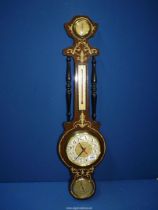 A banjo Barometer/thermometer, hygrometer and clock.