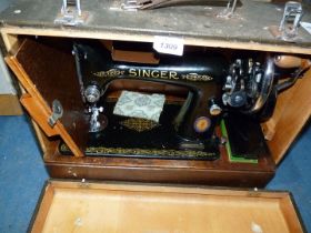 A Singer hand sewing machine, cased.