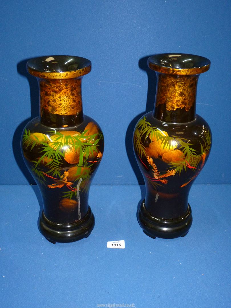 A pair of papier mache lacquered Vases with detail of Herons amongst bamboo stems with a full moon