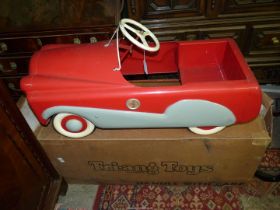 A vintage Tri-ang Toys Mobo T60 red and cream metal Pedal Car with original box.