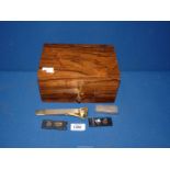 A Cigar Humidor with key, 8 1/2" x 6" x 4" plus three cigar cutters and a 1940's Dunhill lighter.