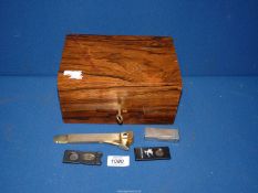 A Cigar Humidor with key, 8 1/2" x 6" x 4" plus three cigar cutters and a 1940's Dunhill lighter.