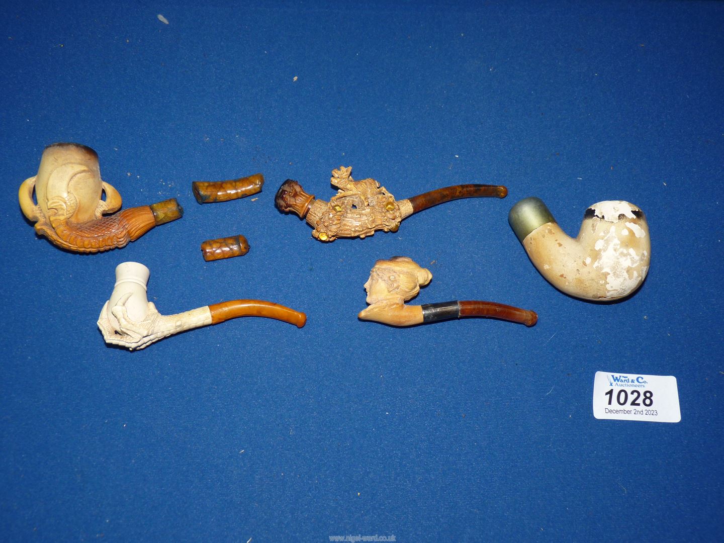 A small tray containing four carved meerschaum pipes/cheroot holders to include; stag, maiden, - Image 2 of 2