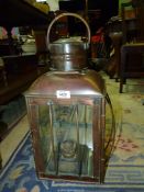 A copper oil lantern by Ansell Jones & Co, Birmingham, one pne cracked, 21'' high x 9'' x 9 1/2''.