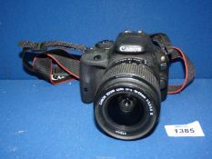 A Canon E05 100D camera.