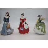 Two Doulton figures 'Winsome' and 'Buttercup' and Coalport 'Touch of Spring'.
