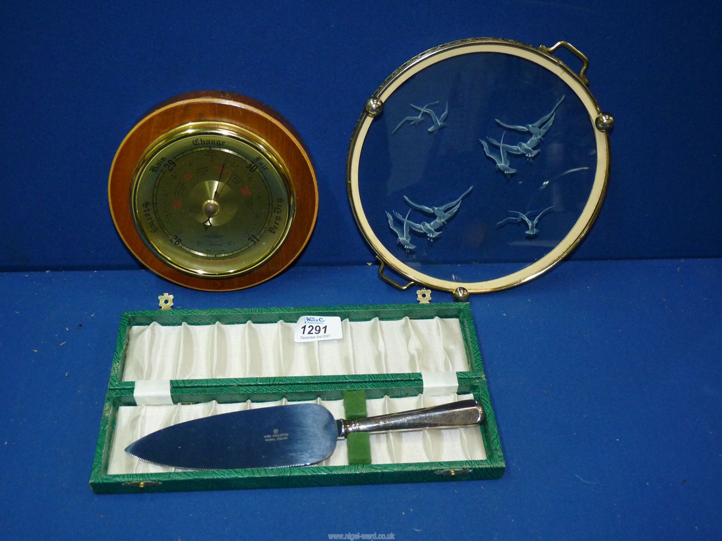 A small round barometer,