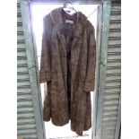 A lady's Mink coat by Augustus Edwards, Hereford together with a mink stole.