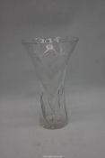 A large cut glass, trumpet shaped vase with etched flower stems, 12 3/4" high.