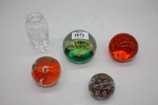 Four paperweights including orange with bubbles, etc.