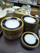 A good quantity of Bavarian dinner ware, in blue and gold decoration, to include; dinner plates,