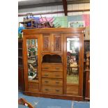 A good probably Edwardian Double Wardrobe the centre with a recess having a cupboard over with