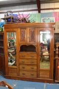 A good probably Edwardian Double Wardrobe the centre with a recess having a cupboard over with