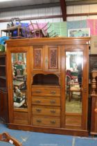 A good probably Edwardian Double Wardrobe the centre with a recess having a cupboard over with