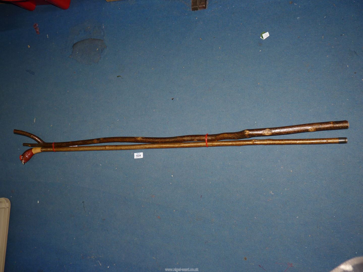 A carved hazel long shank Staff with red grouse knop along with a more traditional 'Y' top hazel
