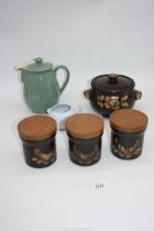 Three Denby 'Bakewell' storage jars, a casserole dish and a Denby hot water pot, etc.