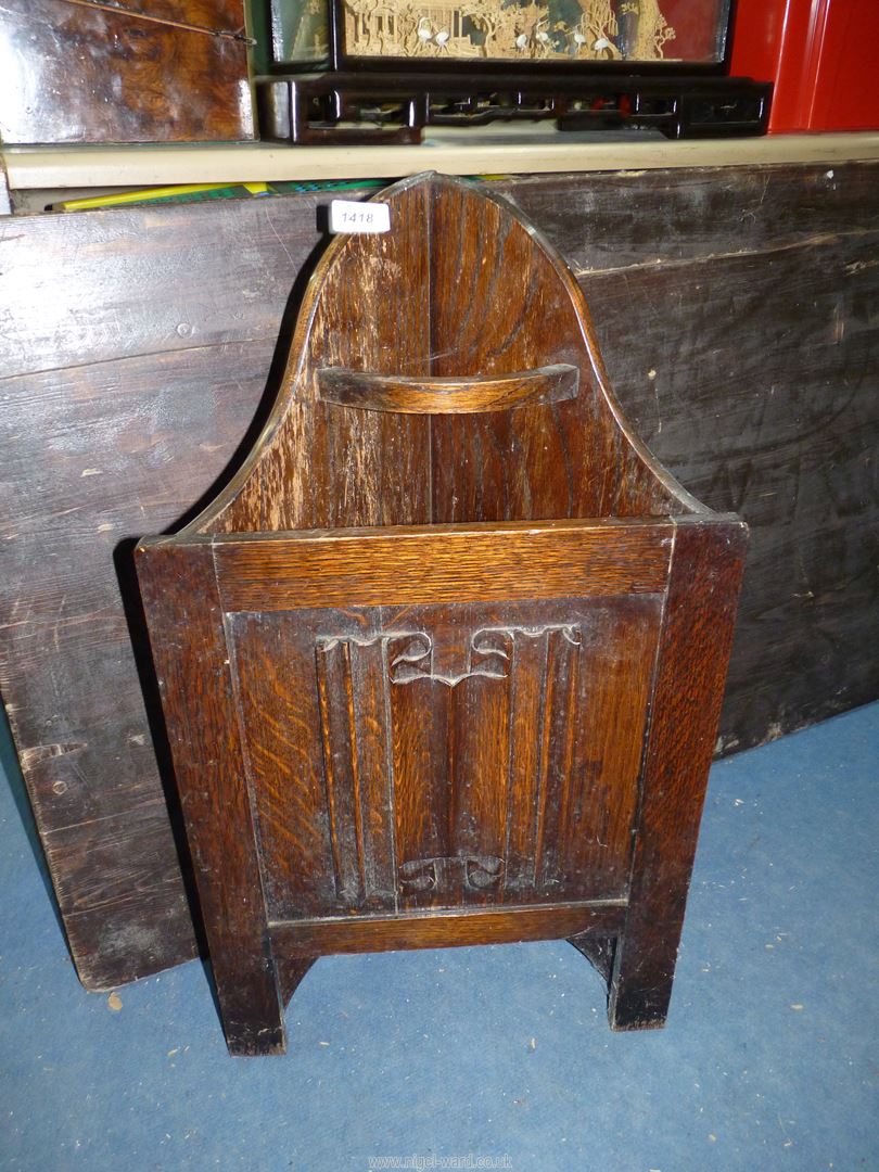 A carved oak corner stick stand, 27 1/2'' tall.