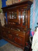 A most substantial and imposing Satinwood mirrorback Sideboard having three cupboards to the base