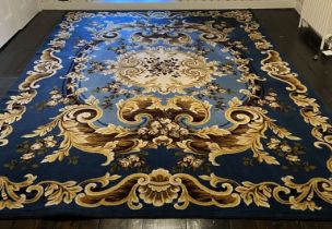 An Aubussom style Rug, blue ground with gold scrolls, 12ft x 9ft.