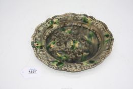 A good 18th century Whieldon Pottery plate with a tortoiseshell glaze and beaded edge,