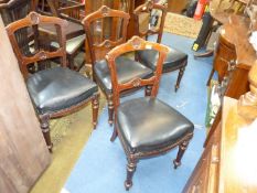A set of four Mahogany framed circa 1900 Dining Chairs having turned front legs and a shell feature