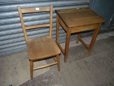 A child's vintage school desk and chair, both ex Hereford Cathedral Preparatory School,