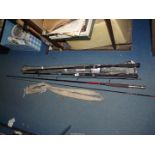 Three fishing rods including two Fladen bronze 7' rods and a Kassmar carbon composite fly rod,