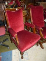 A Satinwood framed open armed fireside Chair standing on cabriole front legs, upholstered in maroon,
