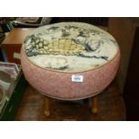 A 1940's circular Stool standing on turned legs, the top illustrating three kittens in a basket,